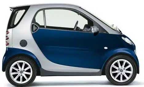 Side profile of blue smart car being part of enterprise mobility